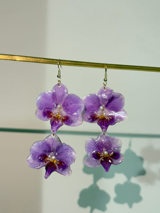 Double lilac Phalaenopsis Earring with fresh water pearl centre.